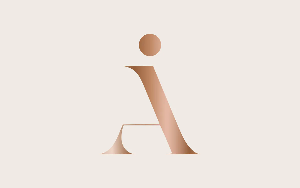 A copper monogram from a brand identity Hearttale designed
